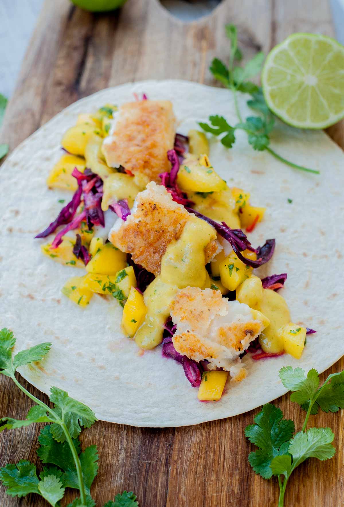 Fish taco ingredients on a tortilla.