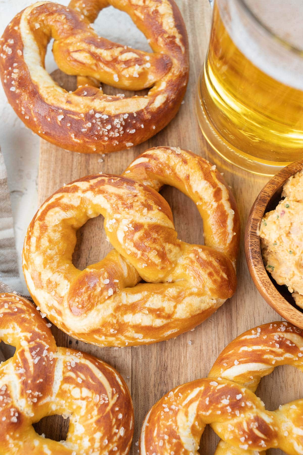 Soft pretzels on a piece of parchment paper.